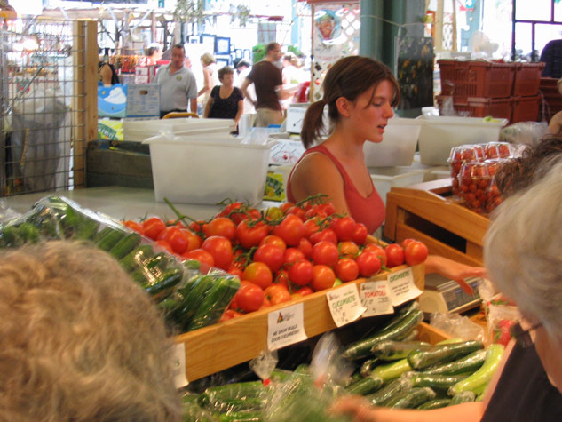 Tomatoes with girl, Old Scona Farmer's Market July 2007